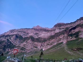 Scenic view of mountains against clear blue sky