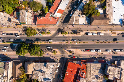 Aerial view of the street intersection with cars driving down the road.