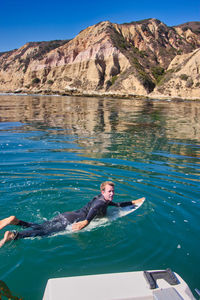 Portrait of man swimming in lake