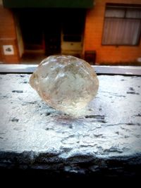 Close-up of frozen ball on snow in building