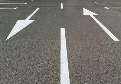 High angle view of arrow sign on road