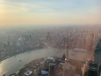 High angle view of city buildings against sky