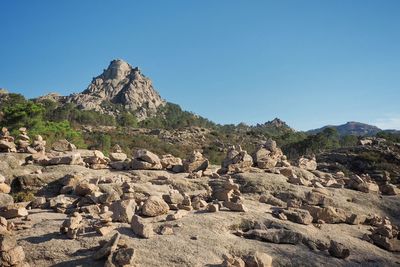 Scenic view of mountains against clear blue sky