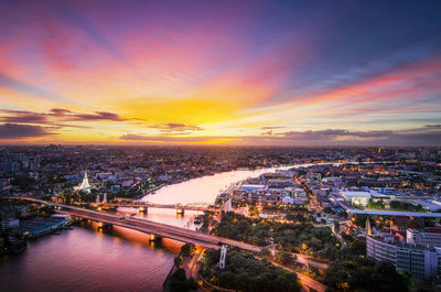 High angle view of city at sunset