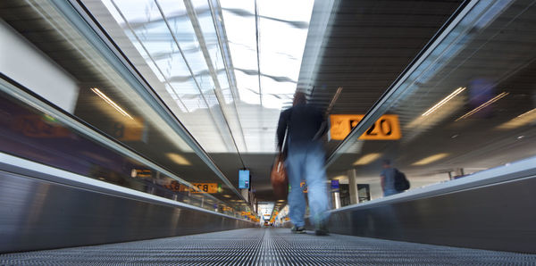 Blurred motion of train at railroad station