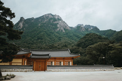 View of temple building against cloudy sky