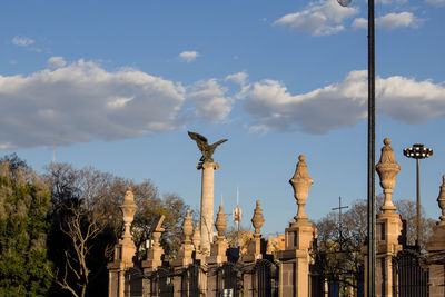 View of sculpture against cloudy sky
