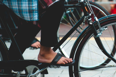 Low section of man riding bicycle