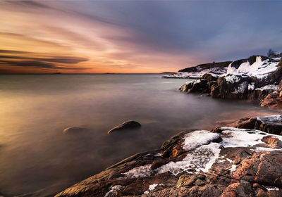 Scenic view of sea against sky during sunset