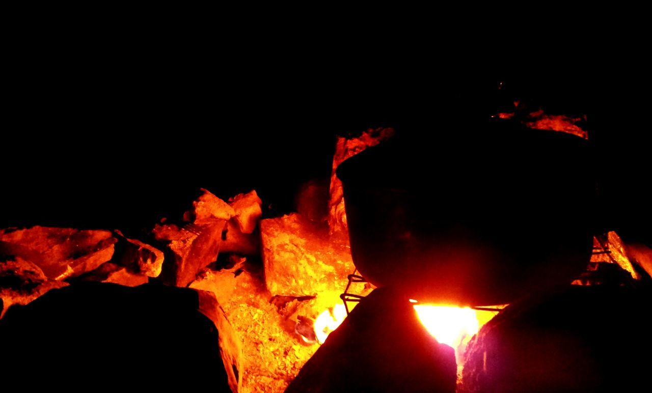 CLOSE-UP OF ILLUMINATED BONFIRE