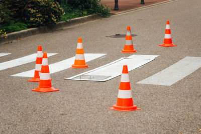 Arrow sign on road in city