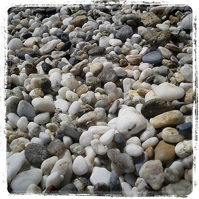 transfer print, auto post production filter, abundance, large group of objects, pebble, stone - object, backgrounds, full frame, stack, rock - object, nature, outdoors, no people, stone, heap, day, textured, beach, close-up, high angle view