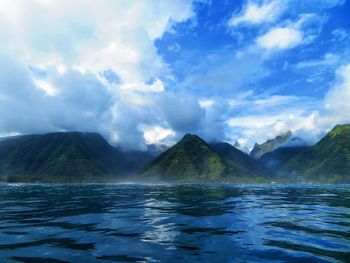 Scenic view of sea against cloudy sky