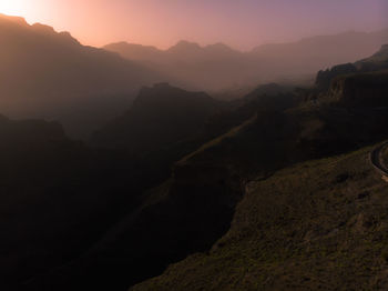 Scenic view of mountains against sky during sunset