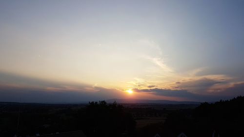 Scenic view of silhouette landscape against sky during sunset