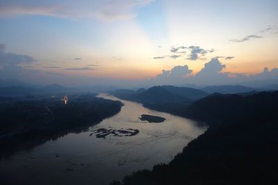 Scenic view of silhouette mountains against sky during sunset