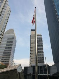 Low angle view of modern buildings against sky in city