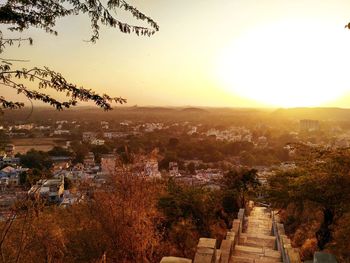 Aerial view of landscape against sky at sunset