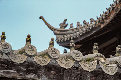 Low angle view of statue against sky