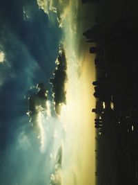 Clouds over city at sunset