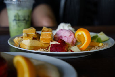 Close-up of fruits in plate on table