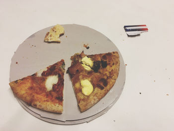 High angle view of pizza in plate on table