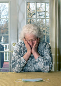 Older woman is stressed about masking and illness, during the covid quarantine