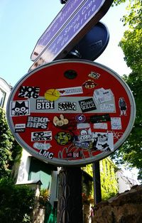 Low angle view of information sign against sky