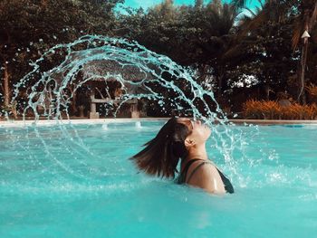 Woman swimming in pool