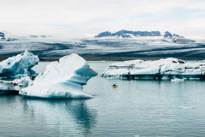 Scenic view of frozen lake against sky