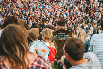 Rear view of people looking at crowd