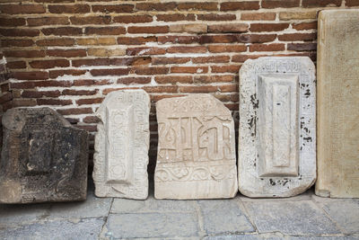 Close-up of carvings on brick wall