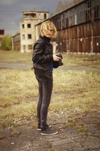 Full length of woman standing on field