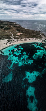 High angle view of sea shore against sky