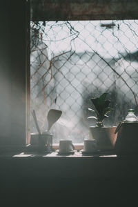 Close-up of glass window on table at home