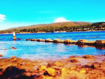 Scenic view of lake against blue sky