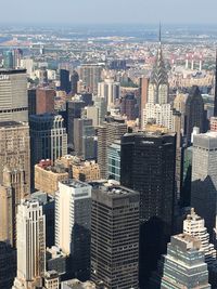 Aerial view of modern buildings in city against sky