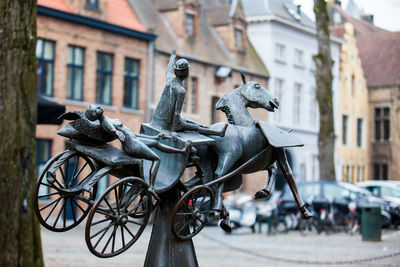 Statue zeus, leda, prometheus and pegasus visit bruges by jef claerhout in honor to city coachmen