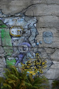 Close-up of graffiti on wall