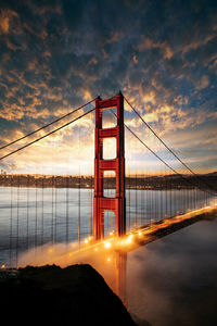 View of suspension bridge at sunset