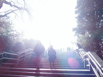 Full length of people walking on steps