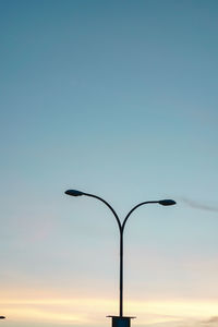 Low angle view of street light against sky