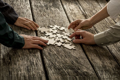 High angle view of men playing on table