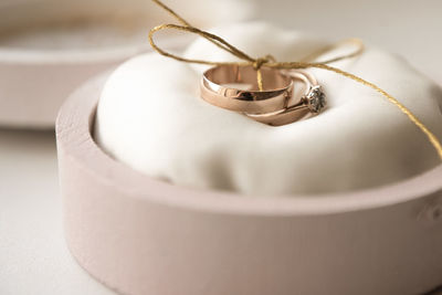 Close-up of wedding rings on table