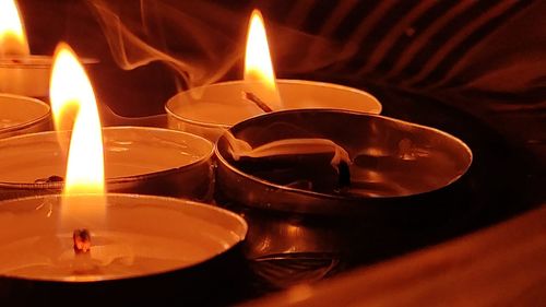 Close-up of lit tea light candles