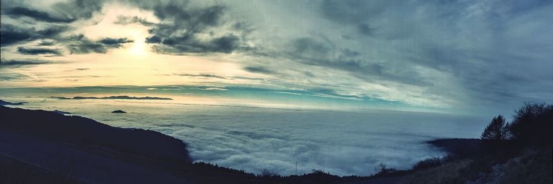 Scenic view of sea against cloudy sky