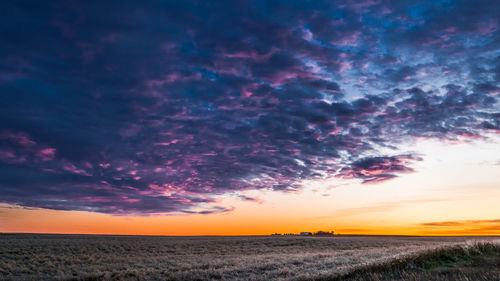 Scenic view of dramatic sky over land