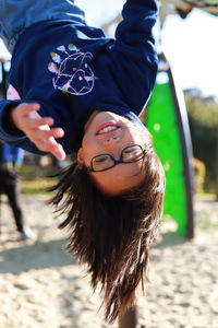 Portrait of smiling boy playing at playground