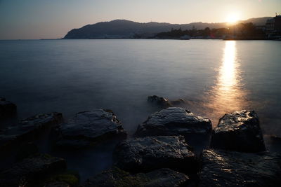 Scenic view of sea against sky during sunset
