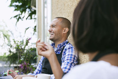 Portrait of man sitting outdoors